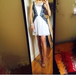 White summer dress with waist slimming black lace